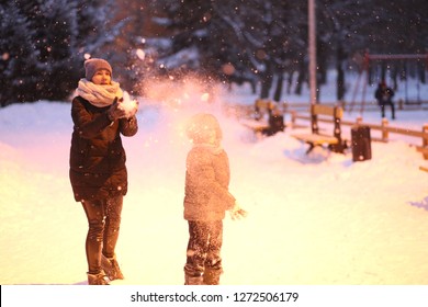 Family Mother With Child Play Outside In Park Winter Snow Season Joy