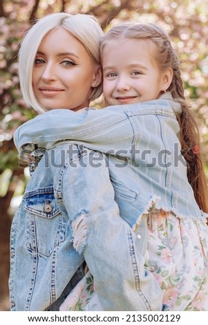 Similar – Granddaughter hugging her grandmother