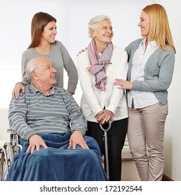 Family With Mother And Daughter And Two Senior Citizens At Home