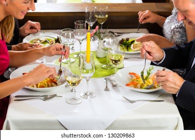 Family, Mother And Father With Adult Children And Daughter Or Son In Law Ã?Â¢??fine Dining In Nice Restaurant Or Hotel