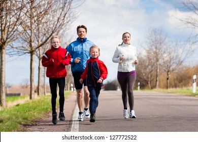 Family, Mother, Father And Children Are Running Or Jogging For Sport Outdoors