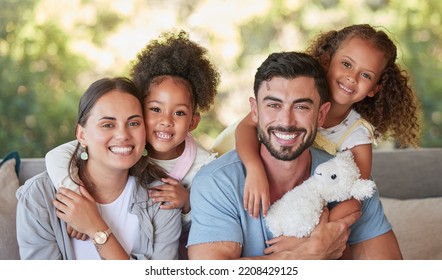 Family, Mother And Father With Foster Children Hugging In A Happy Portrait Together Love Sharing Quality Time Together. Girls, Dad And Mom Are Proud Adoption Parents Of Cute Kids Enjoying The Weekend