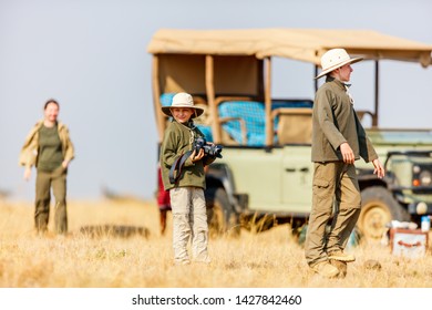 Family Of Mother And Kids On African Safari Vacation Enjoying Time Outdoors