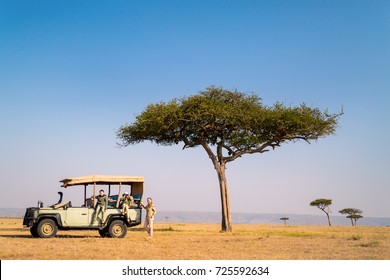 Family Of Mother And Kids On African Safari Vacation Enjoying Morning Game Drive