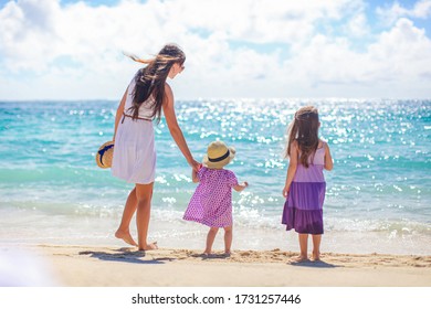 Family Of Mother And Kids On The Beach Vacation