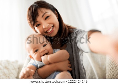 Similar – Young asian woman taking photo with her smartphone