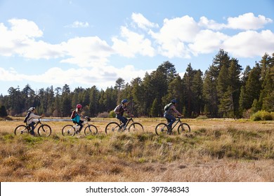 Family Mountain Biking In Countryside, California