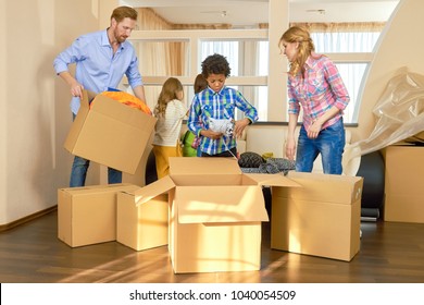 Family moving out. People packing boxes indoors. Importance of helping each other. - Powered by Shutterstock