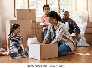 Family, moving and packing boxes into home living room together with children, mom and dad. Property, real estate investment and house move with couple, kids helping box and cardboard unpacking - Powered by Shutterstock