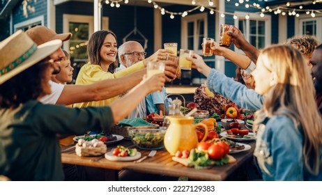 Family and Multicultural Diverse Friends Gathering Together at a Garden Dinner Party. Old and Young People Raising and Toasting Glasses with Fresh Orange Juice and Celebrating the Occasion. - Powered by Shutterstock