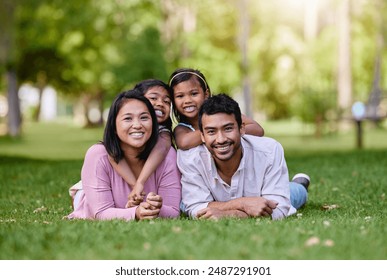 Family, nature and relax in portrait for wellness or happiness, together in park for bonding. Mixed race people, children and parents with support for vacation in Europe, smile for travel with kids - Powered by Shutterstock