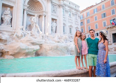 Family Near Fontana Di Trevi, Rome, Italy. Happy Parents And Kids Enjoy Italian Vacation Holiday In Europe.