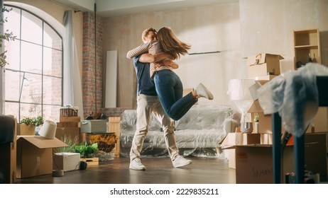 Family New Home Moving in: Happy Girlfriend Returns Home and Finds Her Happy Man Doing Unpacking, They Hug and Dance. Happy Couple in their Cozy Sunny Apartment. Mortgage Loan, Home Renovations - Powered by Shutterstock