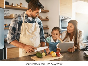 Family, nutrition and diet with people, tablet and ingredients for salad recipe on kitchen counter for dinner. Healthy, food and meal prep with cooking, together and bonding for clean eating in home - Powered by Shutterstock