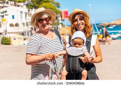 A Family On The Beach Of Sa Tuna On The Coast Of Begur In Summer, Girona On The Costa Brava Of Catalonia In The Mediterranean