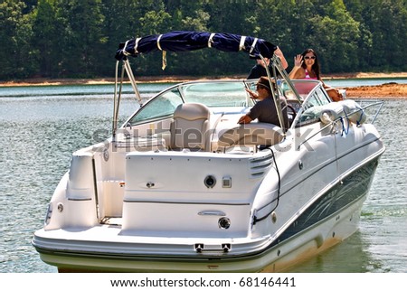 A family on a boat waving as they get ready to leave.