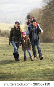 Family On Country Walk In Winter