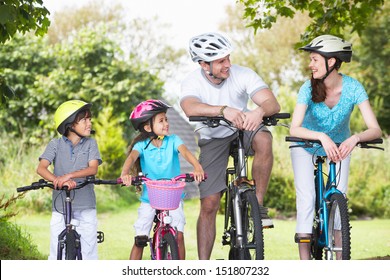 Family On Cycle Ride In Countryside