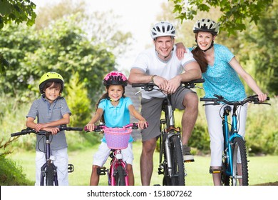 Family On Cycle Ride In Countryside