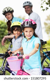 Family On Cycle Ride In Countryside