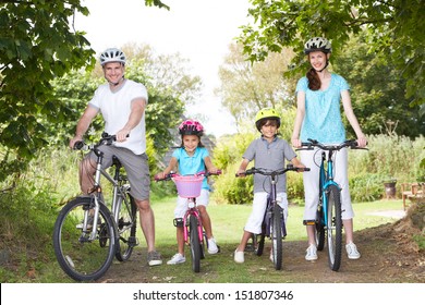 Family On Cycle Ride In Countryside