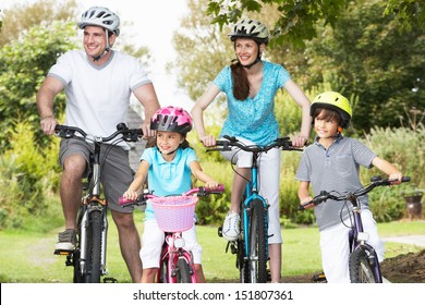 Family On Cycle Ride In Countryside