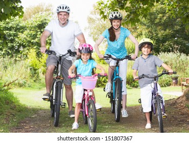 Family On Cycle Ride In Countryside