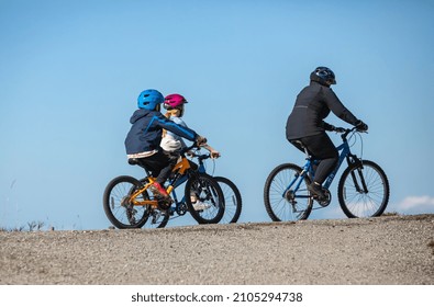 Family On Cycle Ride Through Park. Street View, Travel Photo, Selective Focus-October 11, 2021-Richmond BC, Canada