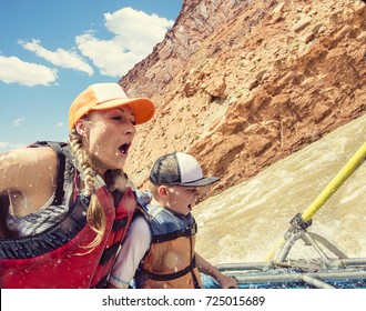 Family On An Exciting Rafting Trip Down The Colorado River 