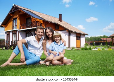 Family on lawn at home
