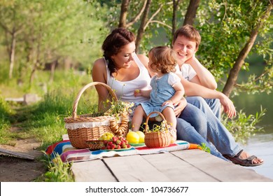 Family on picnic near the lake