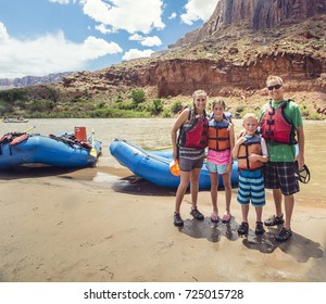 Family On A Rafting Trip Down The Colorado River 