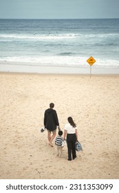 family on summer holiday vacation, parents and children holding hand and walking along tropical - Shutterstock ID 2311353099