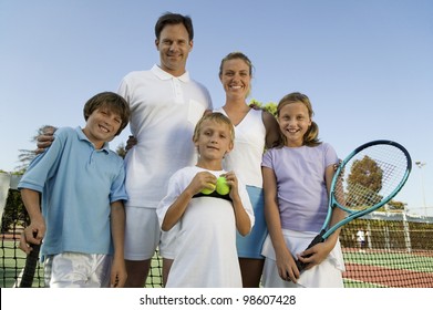 Family On Tennis Court