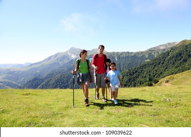 Family On A Trekking Day In The Mountains