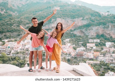 Family On Vacation On Amalfi Coast In Italy