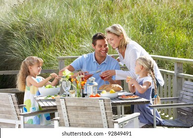 Family On Vacation Eating Outdoors