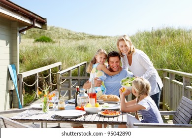 Family On Vacation Eating Outdoors