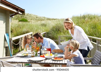 Family On Vacation Eating Outdoors