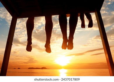 family on vacation, feet silhouette on the beach at sunset, summer holidays travel - Powered by Shutterstock