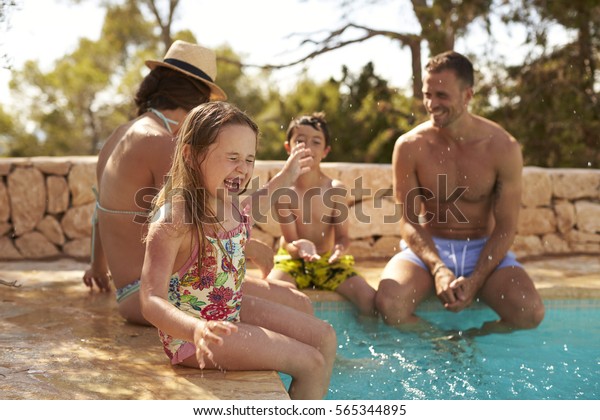 Family On Vacation\
Having Fun By Outdoor\
Pool