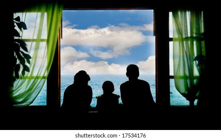 Family On Vacation, Silhouettes On Sky Background