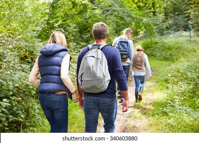 Family On Walk Through Beautiful Countryside