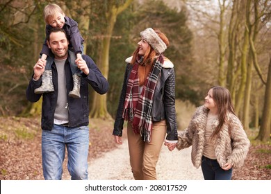 Family On Winter Countryside Walk Together