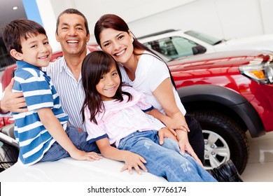 Family Out Shopping For A New Car At The Dealership