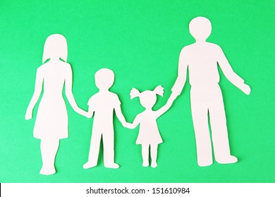 Family From Paper On Bright Background