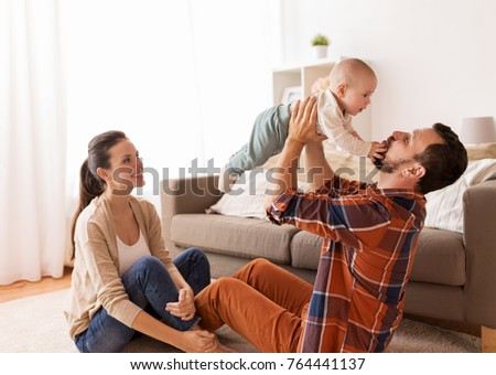 Similar – Image, Stock Photo Mother and baby playing around the Christmas Tree