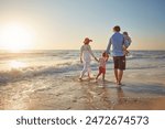 Family, parents and children on beach trip for holiday fun, vacation and adventure with love. Couple, man and woman and kids on seashore walking with sunset for summer break, support and back view