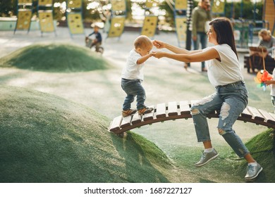 Family in a park. Mother with son. People on a playground. - Powered by Shutterstock