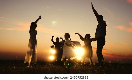 Family party in nature by car, children kids parents dancing together enjoying summer time fun company. Kids sons daughters mom dad having good time with music by car big family travelling road trip - Powered by Shutterstock